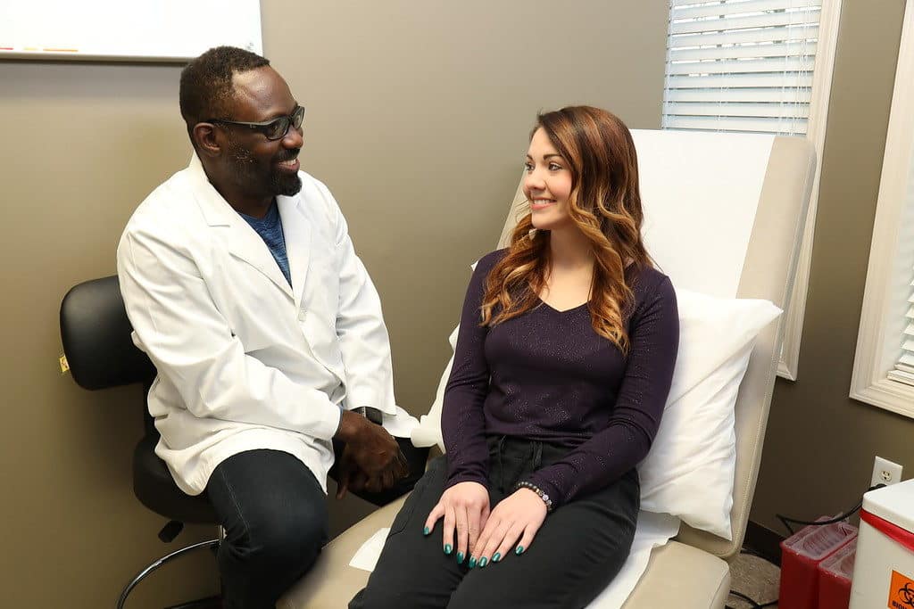 Photo Dr. A. Christopher Ibikunle Talks To A Patient