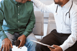A doctor speaking to a patient about what Causes Hernia