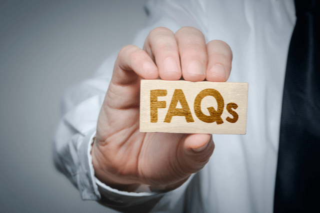 Doctor holding a tag showing Hernia Frequently Asked Questions